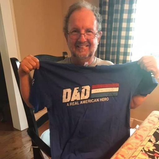 One of our customers opening and loving his Father's Day gift, Dad- A Real American Hero t-shirt. 