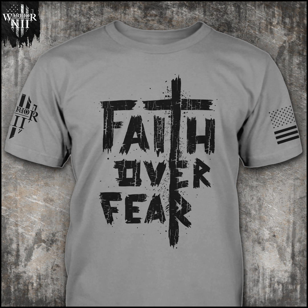 "Faith Over Fear 2.0" is printed on a gray t-shirt with the main design printed on the the front and the back of this t-shirt has no printing. This shirt features our brand logo on the right sleeve and the American Flag on the left sleeve.