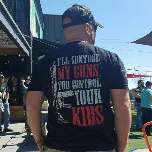 A proud warrior wearing our I'll Control My Guns T-Shirt.