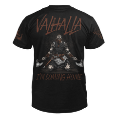 The back of a black t-shirt featuring a Viking warrior on his knees, looking up at the sky, with an axe in each hand with the words "Valhalla I'm coming home."
