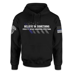 A black hoodie with the words 'Believe In Something, Even If It Means Sacrificing Everything" printed on the front.