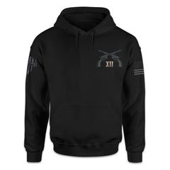 A black hoodie with two pistols crossed over with the Roman numerals XII printed on the front of the shirt.