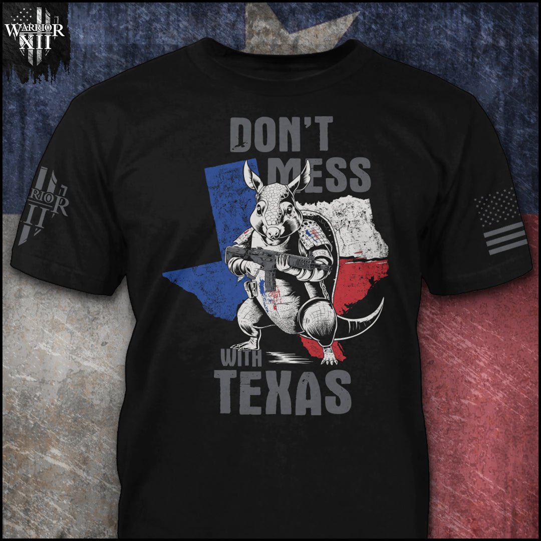 "Don't Mess With Texas" is printed on a Black t-shirt with the main design printed on the the front and the back of this t-shirt has no printing. This shirt features our brand logo on the right sleeve and the American Flag on the left sleeve.