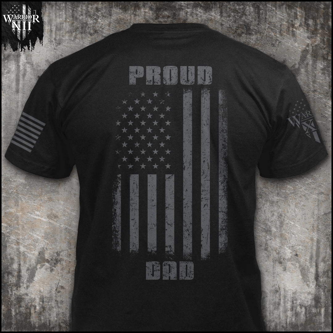 "Proud dad" is printed on a Black t-shirt with the main design printed on the back and a small print on the front left chest.  This shirt features our brand logo on the right sleeve and the American Flag on the left sleeve.