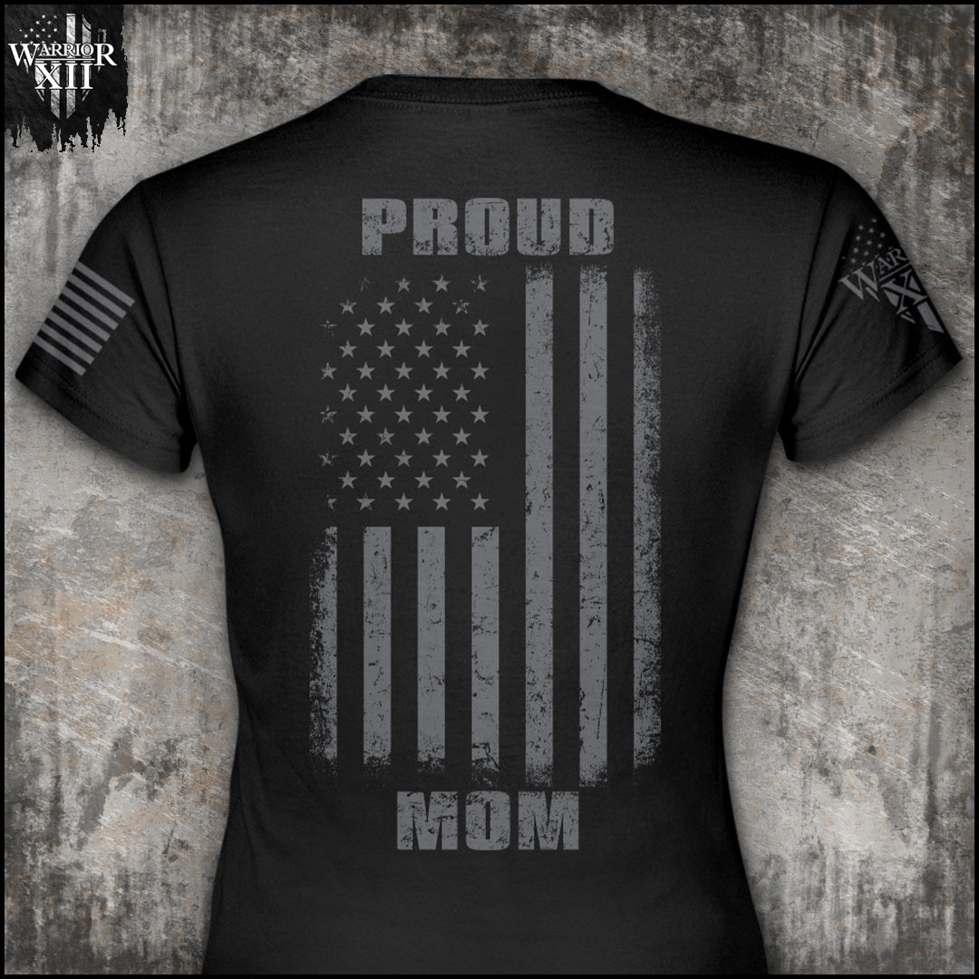 "Proud Mom" is printed on a Black t-shirt with the main design printed on the back and a small print on the front left chest.  This shirt features our brand logo on the right sleeve and the American Flag on the left sleeve.