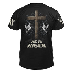 The back of "He Is Risen" featuring the main design of, A cross and two doves.