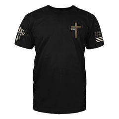The front of "He Is Risen" featuring small chest print of a cross on the upper left side.