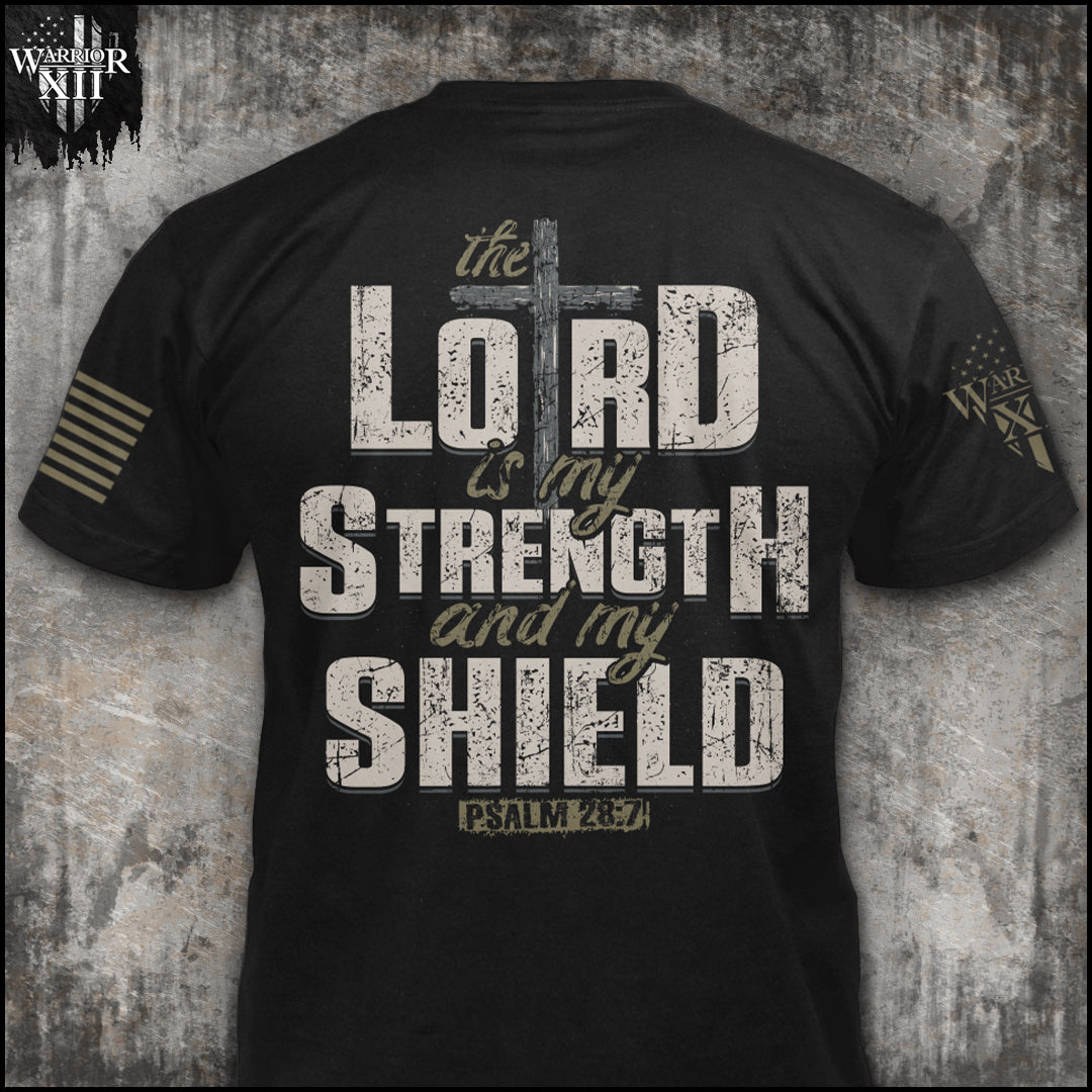 "The Lord Is My Strength" is printed on a Black t-shirt with the main design printed on the back and a small print on the front left chest.  This shirt features our brand logo on the right sleeve and the American Flag on the left sleeve.