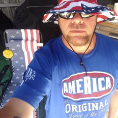 Customer rocking our America-The Original t-shirt while enjoying an outdoor BBQ.