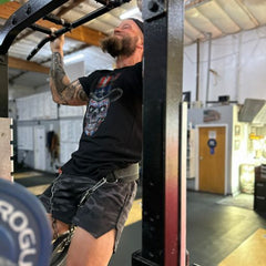 One of our awesome customers getting in a good workout at the gym in his American Sugar Skull t-shirt.