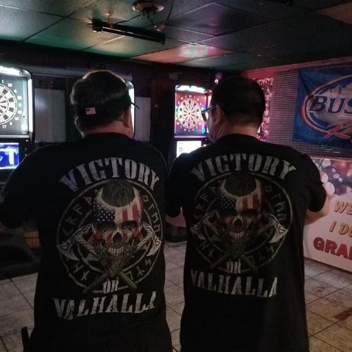 Two of our customers enjoying a night out wearing our American Viking t-shirt with the words "Victory or Valhalla" on the back.