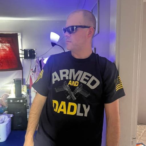 One of our awesome customers enjoying his Armed and Dadly t-shirt.