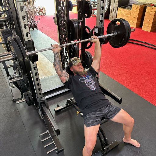 One of our awesome customers hitting the weights in his American Sugar Skull t-shirt.