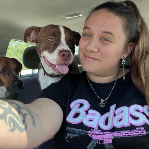Customer enjoying the day out with her dogs while wearing her Badass t-shirt. 