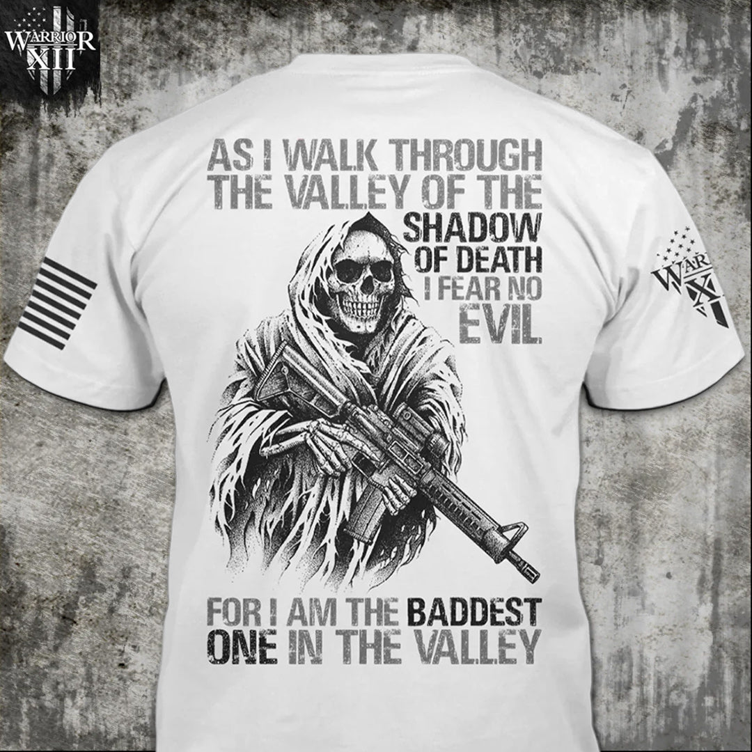 A white Baddest In The Valley t-shirt with the words" As I walk through the valley of the shadow of death, I fear no evil, for I am the baddest one in the valley", printed on the back.
