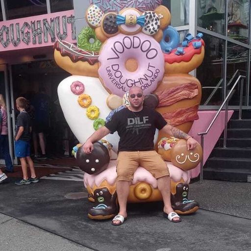 A customer a Voodoo Doughnut wearing his new DILF t-shirt.