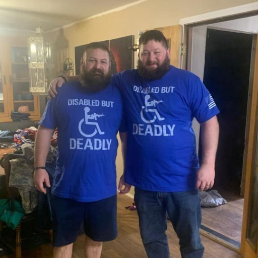 Two good friends wearing our Disabled But Deadly T-Shirt.