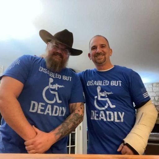 Two true warriors wearing our Disabled But Deadly T-Shirt.