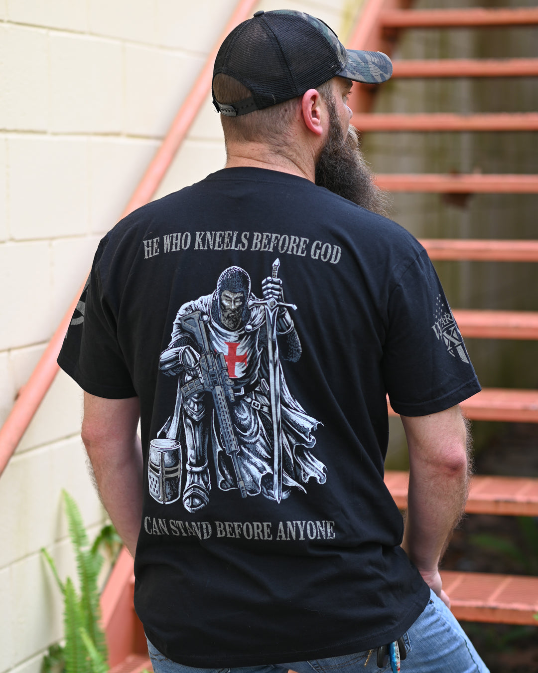 Happy customer waering He Who Kneels Before God shirt