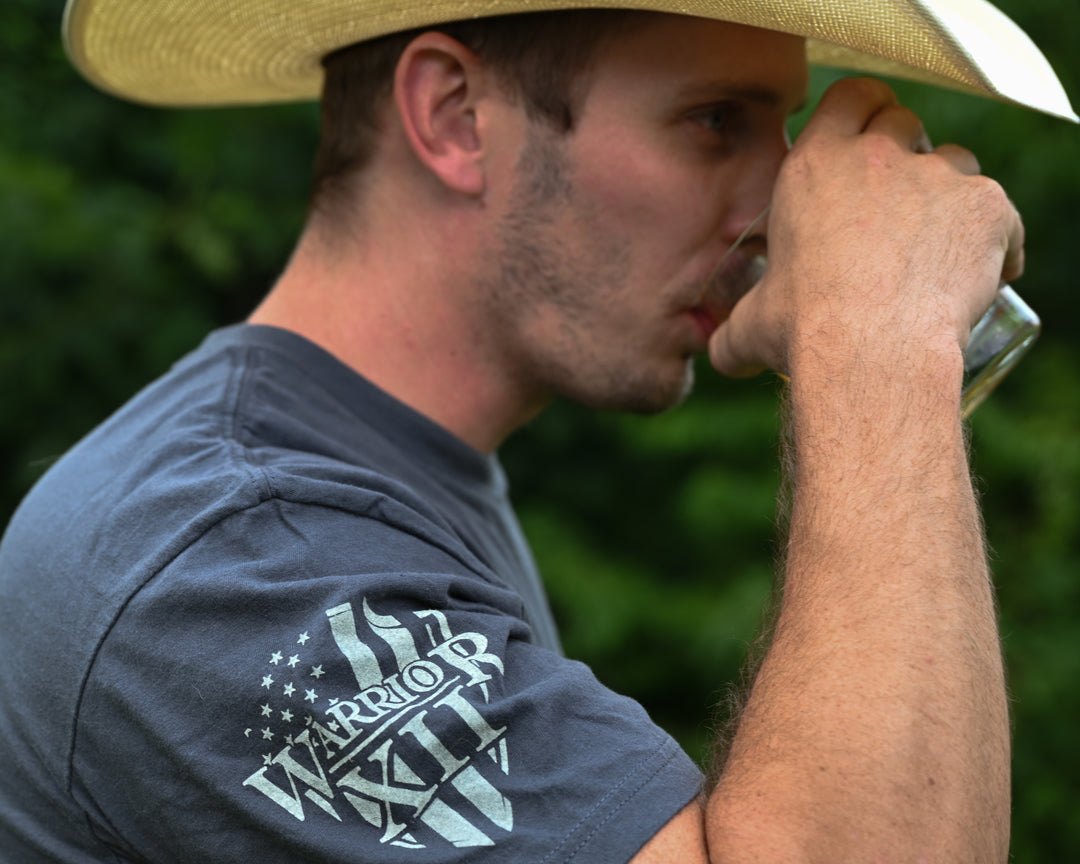 Happy customer showing off his Drink With Your Enemies t-shirt.