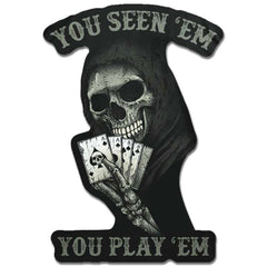 A decal featuring Skeleton with cards with the words "You Seen Em You  Play Em"