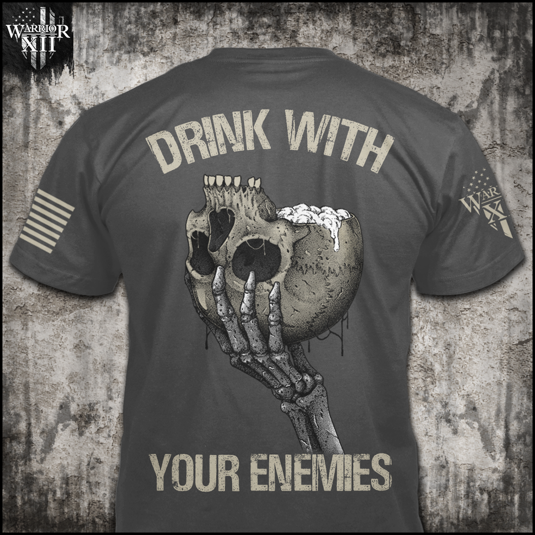 An asphalt grey t-shirt featuring a an upside-down skull with a foamy beverage coming out of the skull on the front and back. The back has the words "Drink with your enemies."