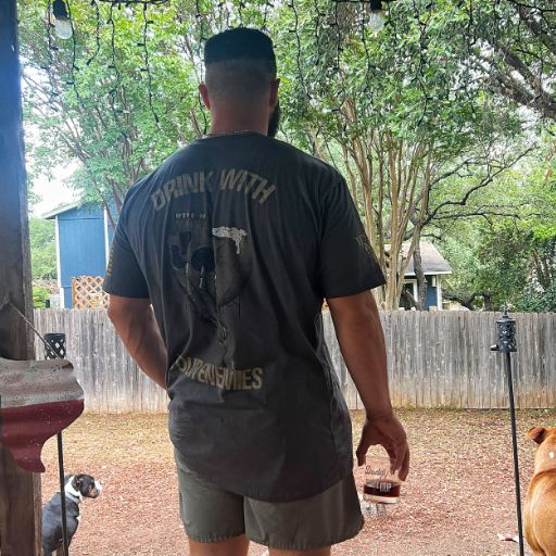 A man and mans best friend sporting our new Drink With Your Enemies T-shirt.
