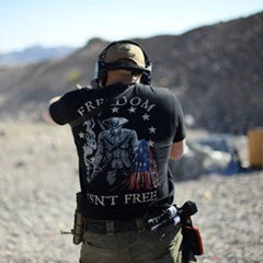 At the range like a true warrior wearing our Freedom Isn't Free T-shirt.