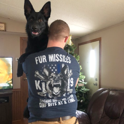A warrior with his own Fur Missile while wearing his new Fur Missile T-shirt.