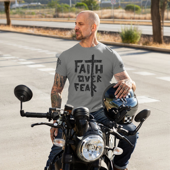 Happy customer showing off his Faith Over Fear t-shirt.