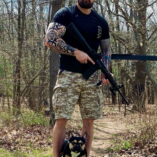 Range day with man's best friend while wearing our Gadsden Snake T-shirt.