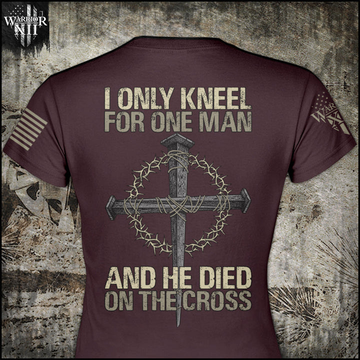 Front & back burgundy women's relaxed fit'shirt with the words "I only kneel for one man, and he died on the cross" with a cross printed on the shirt.