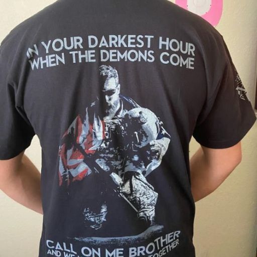 A proud warrior wearing our In Your Darkest Hour T-Shirt.