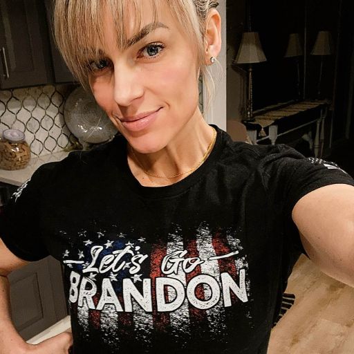 A happy customer enjoying her new Let's Go Brandon T-Shirt.