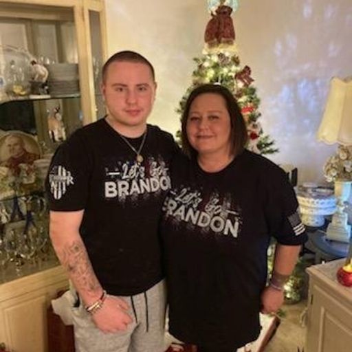 Mother and son enjoying the holidays in style with our Let's Go Brandon T-Shirt.