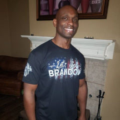 A happy customer enjoying his new Let's Go Brandon T-Shirt.