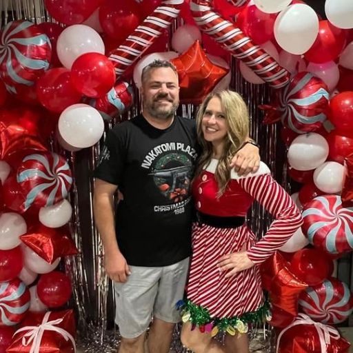 A happy couple sporting their new Nakatomi Plaza Christmas Party T-Shirt.