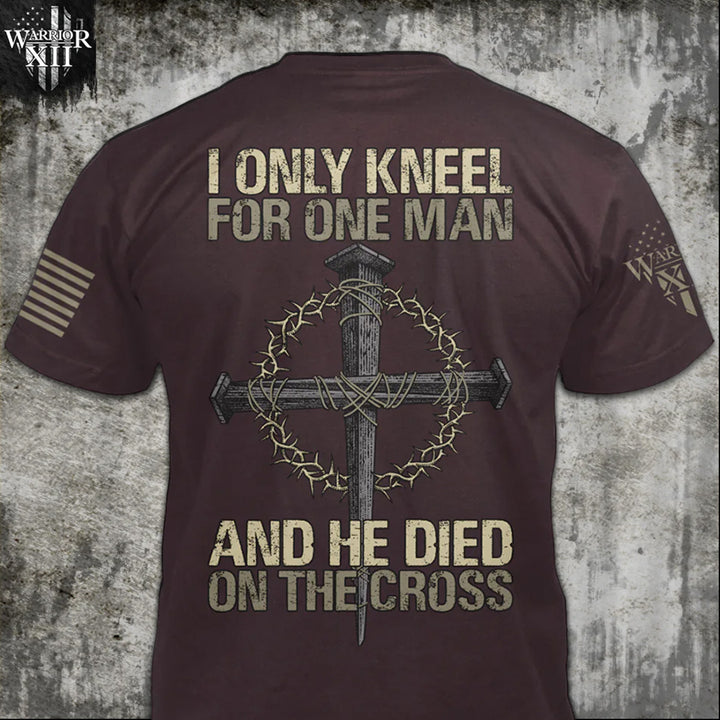 Front & back burgundy t-shirt with the words "I only kneel for one man, and he died on the cross" with a cross printed on the shirt.