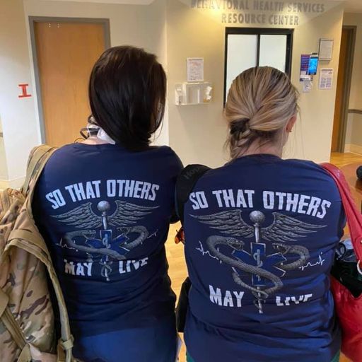 Best friends at work representing our So That Others May Live t-shirt. 