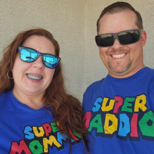 Mom and Dad wearing their awesome new Super Mommio and Super Daddio t-shirts.