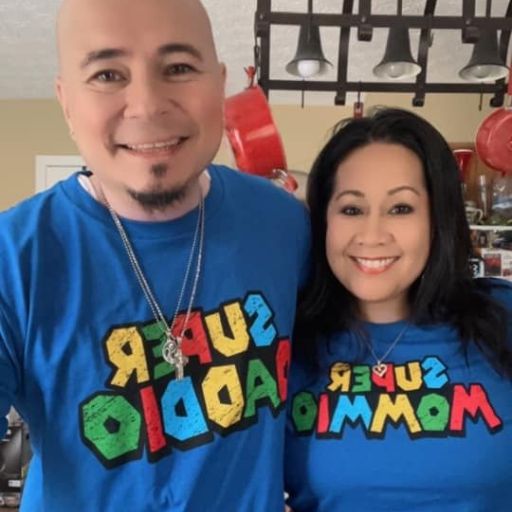 Mom and Dad wearing their awesome new Super Mommio and Super Daddio t-shirts.