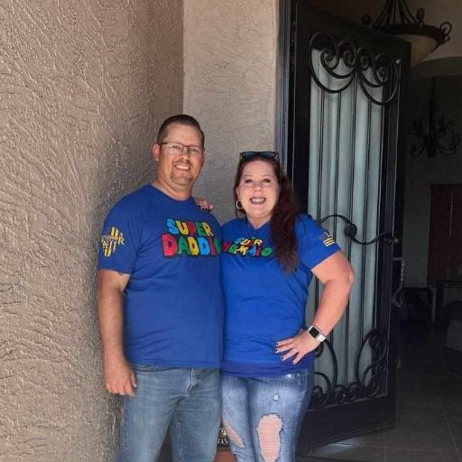 Mom and Dad wearing their awesome new Super Mommio and Super Daddio t-shirts.