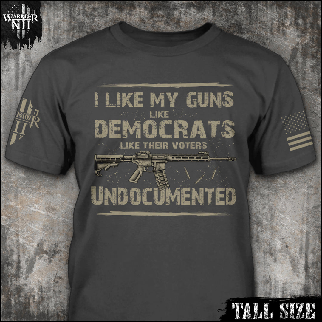 "Undocumented - Tall Size" is printed on a grey t-shirt with the main design printed on the the front and the back of this t-shirt has no printing. This shirt features our brand logo on the right sleeve and the American Flag on the left sleeve.