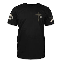 The front of a black t-shirt showing a small pocket image of a cross with a crown of thorns