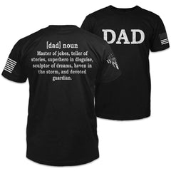 The front and back of a black t-shirt which features the word "DAD" on the front, and on the back a definition of dad as "[dad] noun - Master of jokes, teller of stories, superhero in disguise, sculptor of dreams, haven in the storm, and devoted guardian"