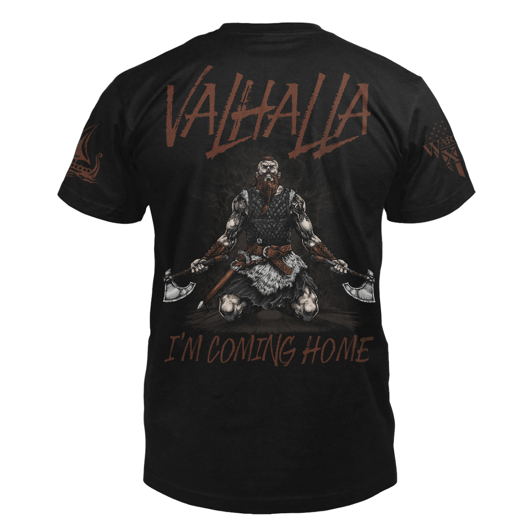 The back of a black t-shirt featuring a Viking warrior on his knees, looking up at the sky, with an axe in each hand with the words "Valhalla I'm coming home."