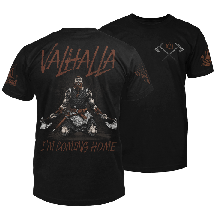 The front and back of a black t-shirt. The back features a viking warrior on his knees, looking up at the sky, with an axe in each hand with the words "Valhalla I'm coming home." The front has a small pocket image of two crossed axes.