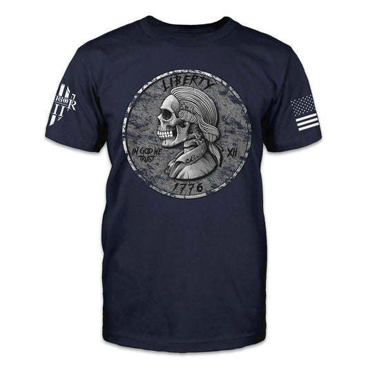 A navy blue t-shirt with an image on the front of a coin with skeletal profile of George Washington with the words Liberty, In god We Trust, and 1776.