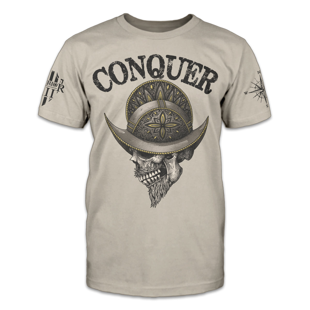A light tan t-shirt which says "conquer" on the front with an image below of a bearded skull wearing a conquistador helmet.