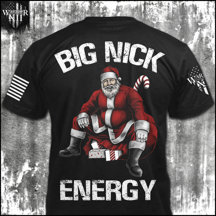 A black t-shirt with an image on the back of Santa Claus sitting on a bag of presents with the words "Big Nick Energy", and a small pocket image on the front of a Santa hat.